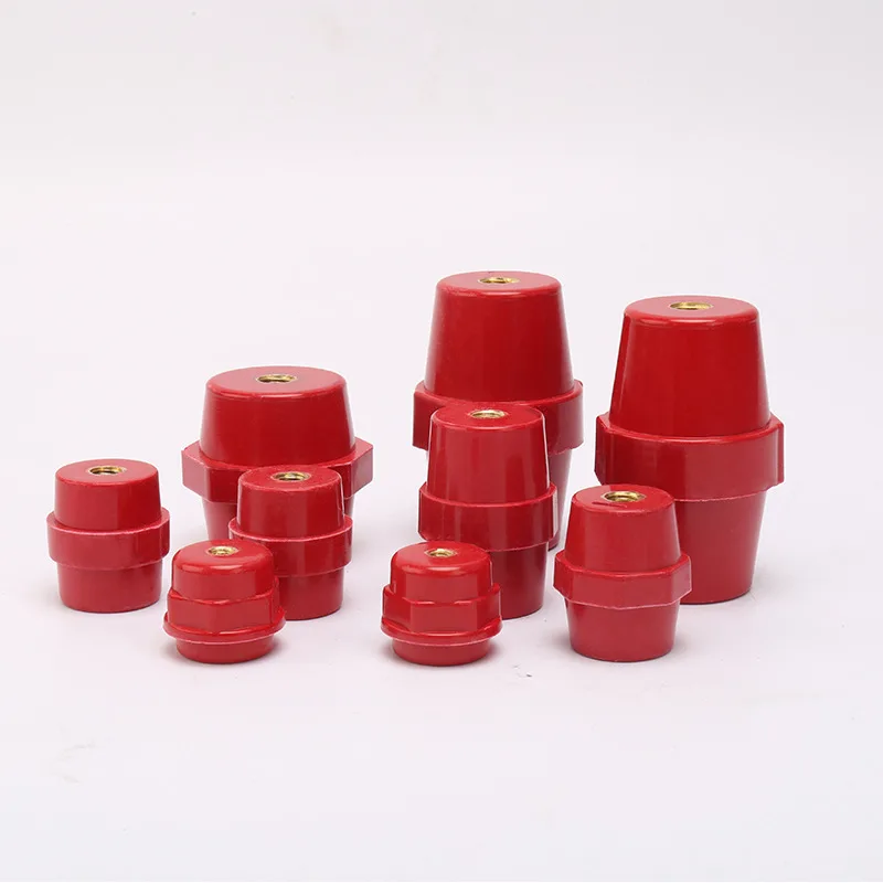 Hexagonal red polymer standoff insulator supporting a copper busbar